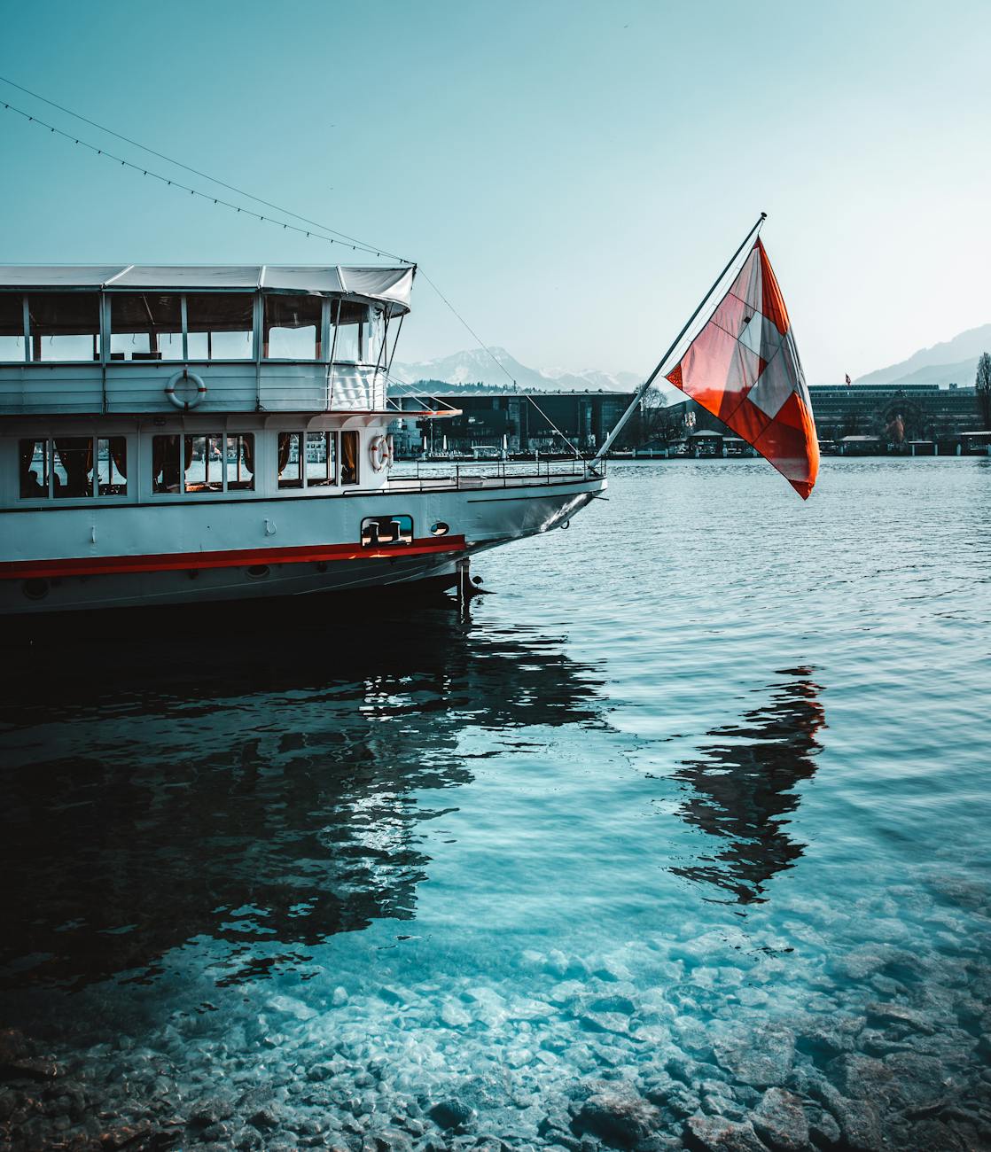 white and red flag on boat
