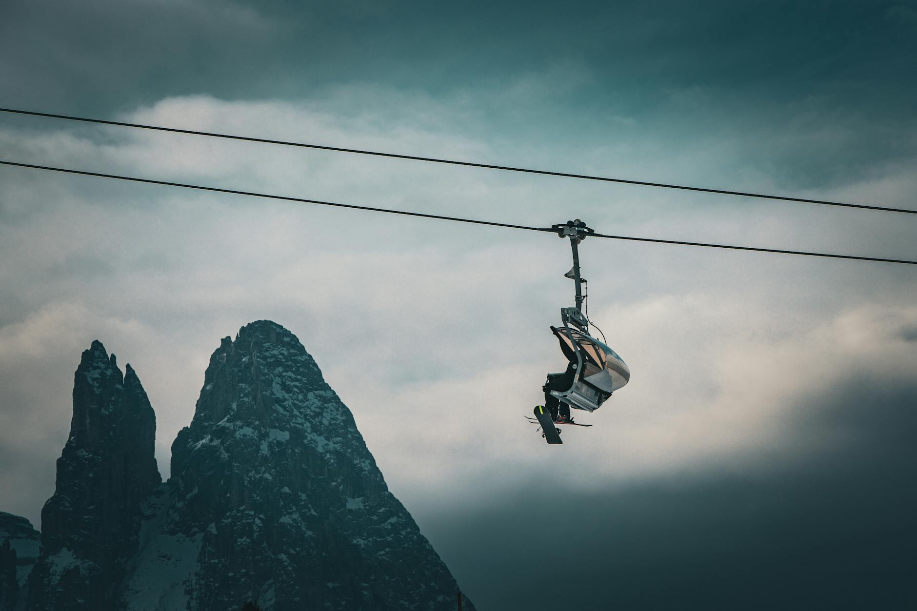 ski lift with stunning dolomite peaks in winter